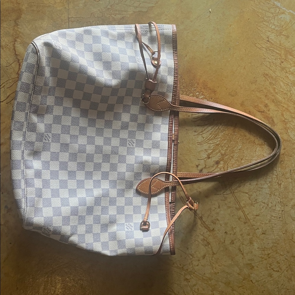 Louis Vuitton White and Tan Checkered Tote
Deleting closet within 24 Hrs. $400 - Picture 4 of 6